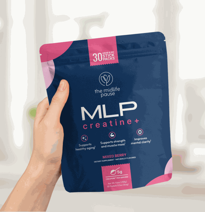 A hand holding a Creatine+ pouch